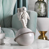 Statue Astronaute Saturne Argent